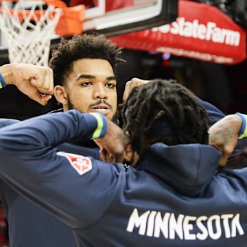 Dec 12, 2021; Portland, Oregon, USA; Minnesota Timberwolves center Karl-Anthony Towns (32) poses with guard Patrick Beverley (22) before a game against the Portland Trail Blazers at Moda Center. The Minnesota Timberwolves won 116-111. Mandatory Credit: Troy Wayrynen-Imagn Images