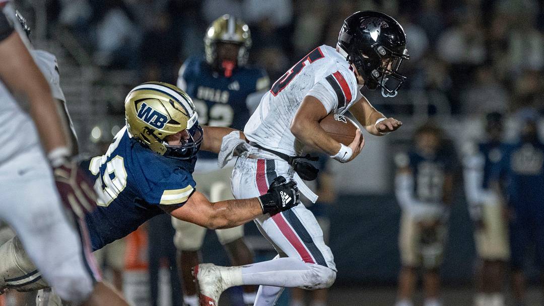 West Boca Xavier Reid tackles Miami Southridge quarterback James Perrone in the state semifinal game on December 6, 2024, in Boca Raton, Florida. West Boca Xavier Reid tackles Miami Southridge quarterback James Perrone in the state semifinal game on December 6, 2024, in Boca Raton, Florida.