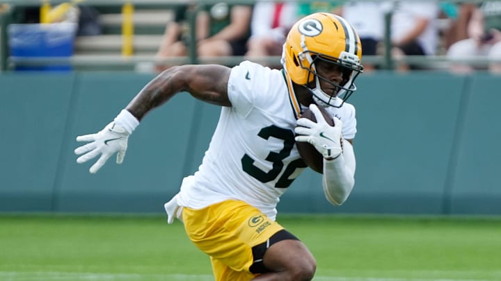 Green Bay Packers running back MarShawn Lloyd (32) runs through a drill during the second day of training camp on Thursday, July 24, 2025, at Ray Nitschke Field in Ashwaubenon, Wis.