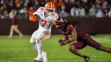 Nov 9, 2024; Blacksburg, Virginia, USA;  Virginia Tech Hokies linebacker Keonta Jenkins (7) dives to tackle Clemson Tigers running back Phil Mafah (7) during the fourth quarter at Lane Stadium. Mandatory Credit: Brian Bishop-Imagn Images