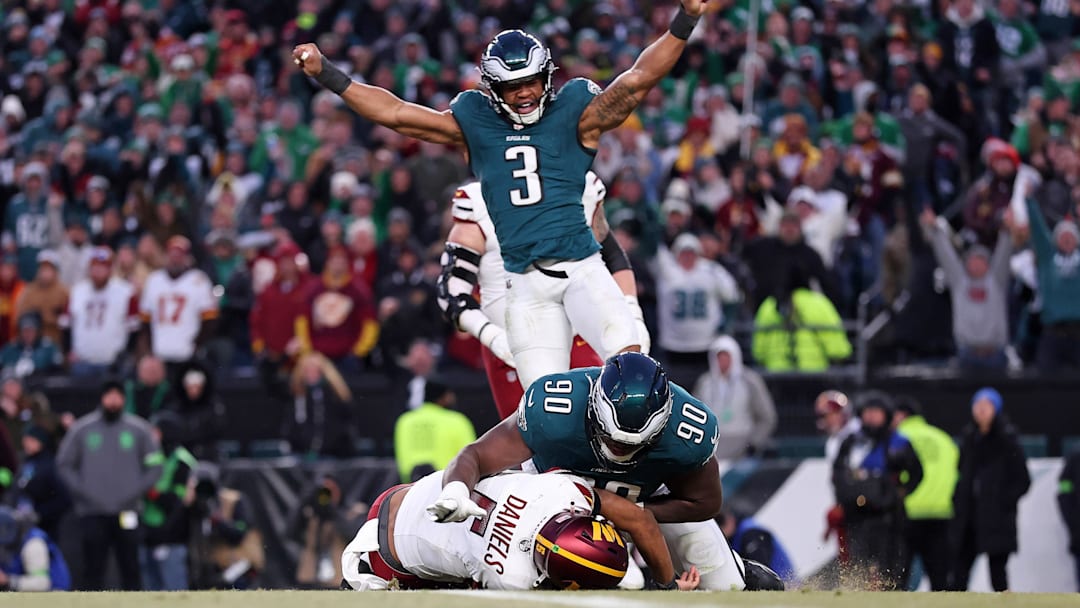 Jan 26, 2025; Philadelphia, PA, USA; Philadelphia Eagles linebacker Nolan Smith Jr. (3) celebrates as defensive tackle Jordan Davis (90) sacks Washington Commanders quarterback Jayden Daniels (5) during the second half in the NFC Championship game at Lincoln Financial Field. Mandatory Credit: Bill Streicher-Imagn Images