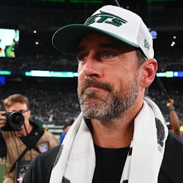 Aug 24, 2024; East Rutherford, New Jersey, USA; New York Jets quarterback Aaron Rodgers (8) walks on the field following the game against the New York Giants at MetLife Stadium.