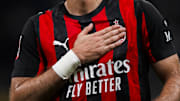 Santiago Gimenez of AC Milan taps his chest and the club...