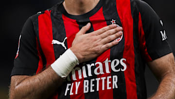 Santiago Gimenez of AC Milan taps his chest and the club...