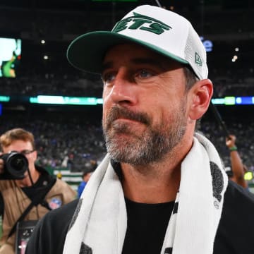 Aug 24, 2024; East Rutherford, New Jersey, USA; New York Jets quarterback Aaron Rodgers (8) walks on the field following the game against the New York Giants at MetLife Stadium.