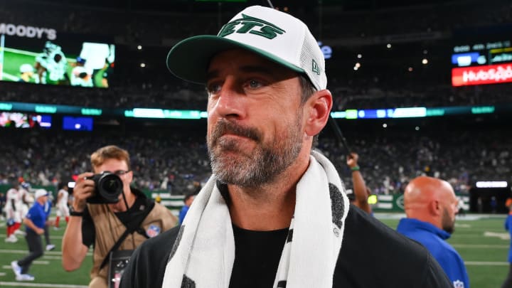 Aug 24, 2024; East Rutherford, New Jersey, USA; New York Jets quarterback Aaron Rodgers (8) walks on the field following the game against the New York Giants at MetLife Stadium.