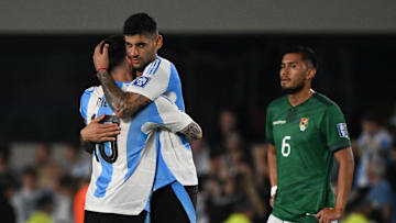 Cristian Romero hugging Lionel Messi during the win over Bolivia 