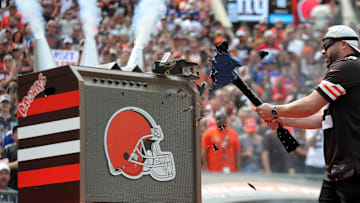 Former Cleveland Guardians second baseman Jason Kipnis smashes a guitar before a Browns game on Sept. 22, 2024, in Cleveland, Ohio.