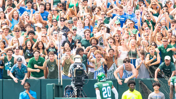 Aug 30, 2025; New Orleans, Louisiana, USA; Tulane Green Wave fans cheer defensive back Jahiem Johnson (20) after he intercepted the pass of Northwestern Wildcats quarterback Preston Stone (not pictured) during the first half at Yulman Stadium. Mandatory Credit: Stephen Lew-Imagn Images