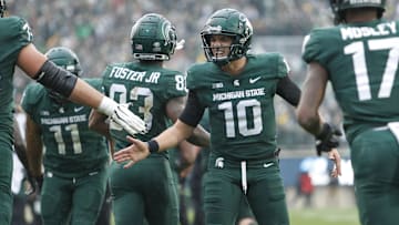 Oct 30, 2021; East Lansing, Michigan, USA; Michigan State Spartans quarterback Payton Thorne (10) celebrates with teammates during the fourth quarter against the Michigan Wolverines at Spartan Stadium. Mandatory Credit: Raj Mehta-Imagn Images