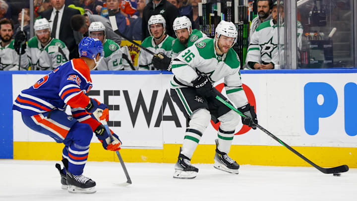 May 27, 2025; Edmonton, Alberta, CAN; Dallas Stars right wing Mikko Rantanen (96) skates with the puck past Edmonton Oilers defenseman Darnell Nurse (25) during the second period in game four of the Western Conference Final of the 2025 Stanley Cup Playoffs at Rogers Place. Mandatory Credit: Perry Nelson-Imagn Images