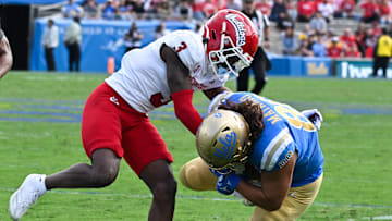 Nov 30, 2024; Pasadena, California, USA; Fresno State Bulldogs defensive back Al'zillion Hamilton (3) tackles UCLA Bruins tight end Moliki Matavao (88) during the second quarter at Rose Bowl. Mandatory Credit: Robert Hanashiro-Imagn Images