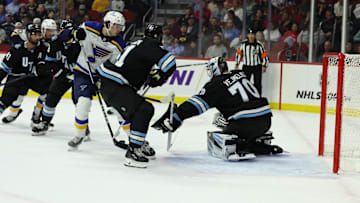 Sep 22, 2024; Des Moines, Iowa, USA;  Utah Hockey Club goaltender Karel Vejmelka (70) makes a save against the St. Louis Blues at Wells Fargo Arena. Mandatory Credit: Reese Strickland-Imagn Images

