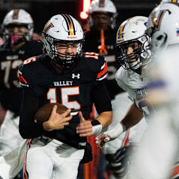 Valley's Drake DeGroote runs the ball during a playoff quarterfinal game at Valley Stadium on Friday, Nov. 8, 2024, in West Des Moines.