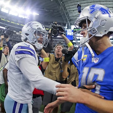 Dallas Cowboys quarterback Dak Prescott (4) greets Detroit Lions quarterback Jared Goff.