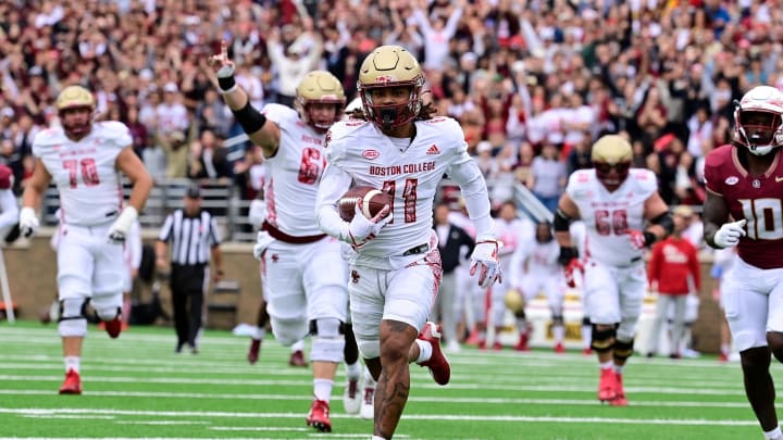 Sep 16, 2023; Chestnut Hill, Massachusetts, USA; Boston College Eagles wide receiver Lewis Bond (11) runs for a touchdown against the Florida State Seminoles during the first half at Alumni Stadium. Mandatory Credit: Eric Canha-USA TODAY Sports