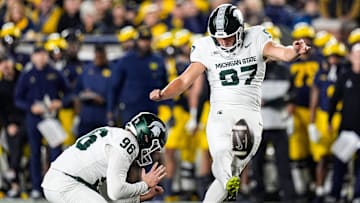 Michigan State place kicker Jonathan Kim (97) attempts a field goal against Michigan during the first half at Michigan Stadium in Ann Arbor on Saturday, Oct. 26, 2024.
