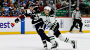 Mar 16, 2025; Denver, Colorado, USA; Colorado Avalanche defenseman Ryan Lindgren (55) and Dallas Stars left wing Jason Robertson (21) battle for position in the first period at Ball Arena. Mandatory Credit: Isaiah J. Downing-Imagn Images