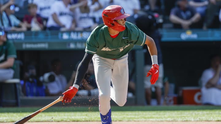 Jul 8, 2023; Seattle, Washington, USA; National League Futures designated hitter Justin Crawford (13) of the Philadelphia Phillies hits an RBI-sacrifice fly against the American League Futures during the second inning of the All Star-Futures Game at T-Mobile Park. 