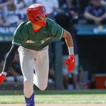 Jul 8, 2023; Seattle, Washington, USA; National League Futures designated hitter Justin Crawford (13) of the Philadelphia Phillies hits an RBI-sacrifice fly against the American League Futures during the second inning of the All Star-Futures Game at T-Mobile Park.