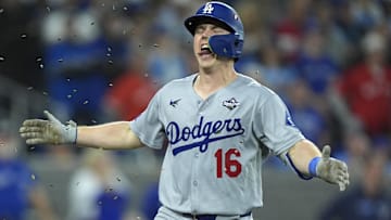 Dodgers catcher Will Smith (16) celebrates after hitting a home run against the Toronto Blue Jays in the eleventh inning during game seven of the 2025 MLB World Series at Rogers Centre on Saturday.