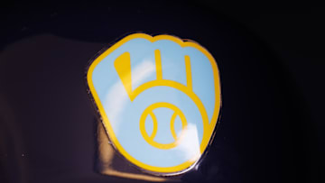 Jun 18, 2023; Milwaukee, Wisconsin, USA;  A Milwaukee Brewers logo on a batting helmet in the dugout prior to the game against the Pittsburgh Pirates at American Family Field. Mandatory Credit: Jeff Hanisch-Imagn Images