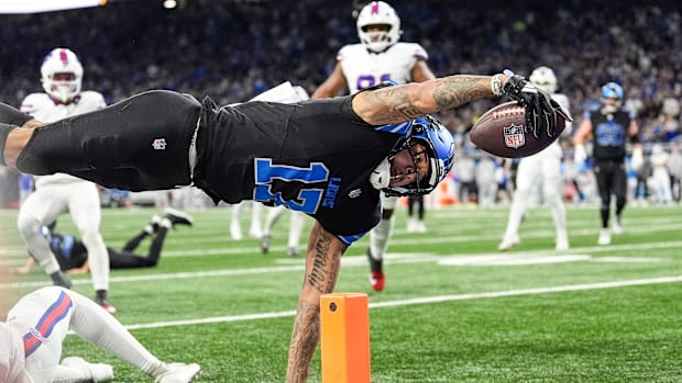 Detroit Lions wide receiver Tim Patrick (17) dives for a touchdown against Buffalo Bills cornerback Christian Benford (47) du