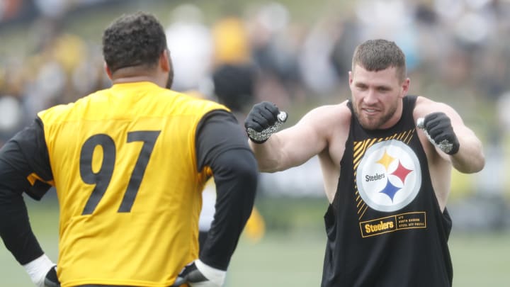 Jul 27, 2023; Latrobe, PA, USA;  Pittsburgh Steelers defensive tackle Cameron Heyward (97) and linebacker T.J. Watt (right) participate in drills during training camp at Saint Vincent College. Mandatory Credit: Charles LeClaire-USA TODAY Sports