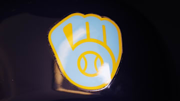 Jun 18, 2023; Milwaukee, Wisconsin, USA;  A Milwaukee Brewers logo on a batting helmet in the dugout prior to the game against the Pittsburgh Pirates at American Family Field. Mandatory Credit: Jeff Hanisch-Imagn Images