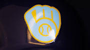 Jun 18, 2023; Milwaukee, Wisconsin, USA;  A Milwaukee Brewers logo on a batting helmet in the dugout prior to the game against the Pittsburgh Pirates at American Family Field. Mandatory Credit: Jeff Hanisch-Imagn Images
