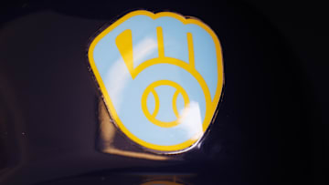 Jun 18, 2023; Milwaukee, Wisconsin, USA;  A Milwaukee Brewers logo on a batting helmet in the dugout prior to the game against the Pittsburgh Pirates at American Family Field. Mandatory Credit: Jeff Hanisch-Imagn Images