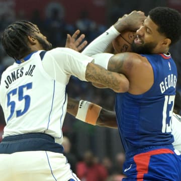  Dallas Mavericks forward Derrick Jones Jr. (55) and Los Angeles Clippers forward Paul George (13) fight for the ball in the first half during game one of the first round for the 2024 NBA playoffs against the Dallas Mavericks at Crypto.com Arena. Mandatory Credit: