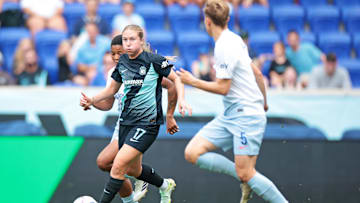 NJ/NY Gotham FC midfielder Delanie Sheehan (17) moves the ball against Seattle Reign FC midfielder Quinn (5) at Red Bull Arena