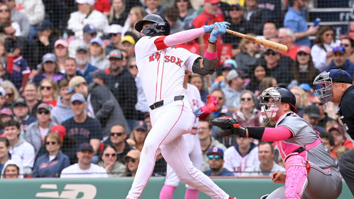 May 12, 2024; Boston, Massachusetts, USA;  Boston Red Sox second baseman Vaughn Grissom (5) hits a single against the Washington Nationals during the sixth inning at Fenway Park. Mandatory Credit: Eric Canha-USA TODAY Sports