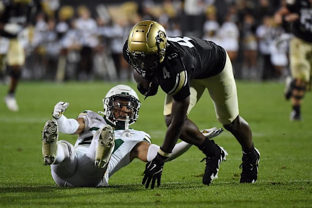 Sep 21, 2024; Boulder, Colorado, USA; Colorado Buffaloes wide receiver Omarion Miller (4) stays on his feet to score after a 
