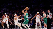 May 16, 2025; New York, New York, USA; Boston Celtics guard Derrick White (9) controls the ball against New York Knicks guard Josh Hart (3) and center Mitchell Robinson (23) and guard Miles McBride (2) during the second quarter of game six in the second round of the 2025 NBA Playoffs at Madison Square Garden. Mandatory Credit: Brad Penner-Imagn Images