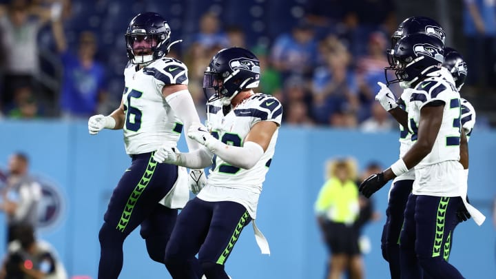 Aug 17, 2024; Nashville, Tennessee, USA; Seattle Seahawks safety Ty Okada (39) celebrates an interception late in the game against the Tennessee Titans at Nissan Stadium. Mandatory Credit: Casey Gower-USA TODAY Sports