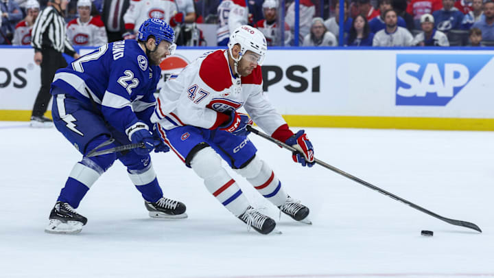 Apr 29, 2026; Tampa, Florida, USA; Montreal Canadiens defenseman Jayden Struble (47) controls the puck from Tampa Bay Lightning right wing Oliver Bjorkstrand (22) in the first period during game five of the first round of the 2026 Stanley Cup Playoffs at Benchmark International Arena. Mandatory Credit: Nathan Ray Seebeck-Imagn Images