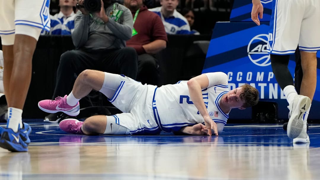 Mar 13, 2025; Charlotte, NC, USA; Duke Blue Devils forward Cooper Flagg (2) is injured in the first half at Spectrum Center. Mandatory Credit: Bob Donnan-Imagn Images