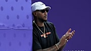 Carmelo Anthony watches Olympic 3x3 basketball in 2024.