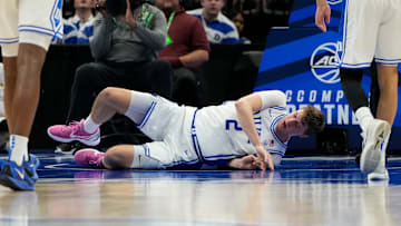 Mar 13, 2025; Charlotte, NC, USA; Duke Blue Devils forward Cooper Flagg (2) is injured in the first half at Spectrum Center. Mandatory Credit: Bob Donnan-Imagn Images