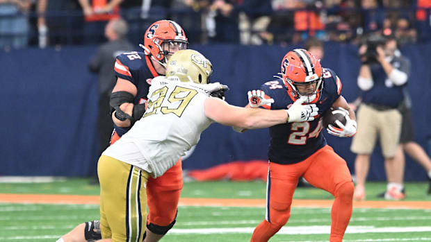 Sep 7, 2024; Syracuse, New York, USA; Syracuse Orange running back Will Nixon (24) avoids a tackle by Georgia Tech Yellow Jac