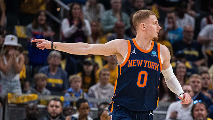 May 12, 2024; Indianapolis, Indiana, USA;  New York Knicks guard Donte DiVincenzo (0) celebrates a made basket during game four of the second round for the 2024 NBA playoffs against the Indiana Pacers at Gainbridge Fieldhouse. Mandatory Credit: Trevor Ruszkowski-Imagn Images