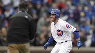 Chicago Cubs left fielder Matt Szczur celebrates with his teammates after hitting in the game winning run against the Philadelphia Phillies at Wrigley Field. 