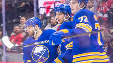 Jan 9, 2025; Ottawa, Ontario, CAN; Buffalo Sabres center Dylan Cozens (24) celebrates with team after scoring a goal in the second period against the Ottawa Senators at the Canadian Tire Centre. Mandatory Credit: Marc DesRosiers-Imagn Images
