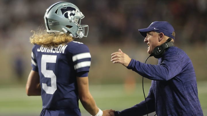 Kansas State freshman quarterback Avery Johnson (5) is applauded by head coach Chris Klieman after scoring a touchdown in the fourth quarter of Saturday's game against Southeast Missouri State inside Bill Snyder Family Stadium.