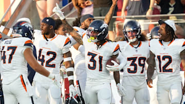 Aug 9, 2025; Santa Clara, California, USA;  Denver Broncos inside linebacker Karene Reid (47) and safety Drew Sanders (42) and cornerback Kris Abrams–Draine (31) and cornerback Joshua Pickett (39) and cornerback Jahdae Barron (12) celebrate an interception, that was later nullified, in the third quarter against the San Francisco 49ers at Levi's Stadium. Mandatory Credit: David Gonzales-Imagn Images