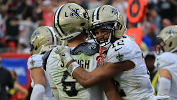New Orleans Saints quarterback Tyler Shough (6) and wide receiver Chris Olave (12)