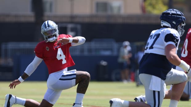 Dallas Cowboys quarterback Dak Prescott (4) stretches during training camp at the River Ridge Playing Field