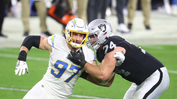 Dec 17, 2020; Paradise, Nevada, USA; Los Angeles Chargers defensive end Joey Bosa (97) against Las Vegas Raiders offensive tackle Kolton Miller (74) at Allegiant Stadium. Mandatory Credit: Mark J. Rebilas-USA TODAY Sports